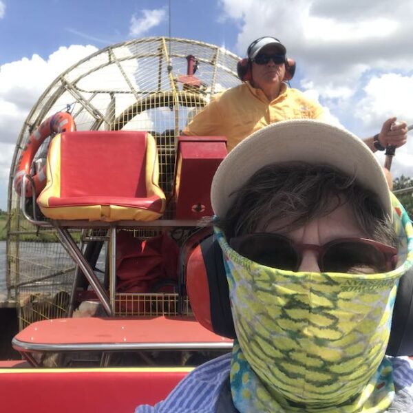 Photo of Billie Best on air boat.